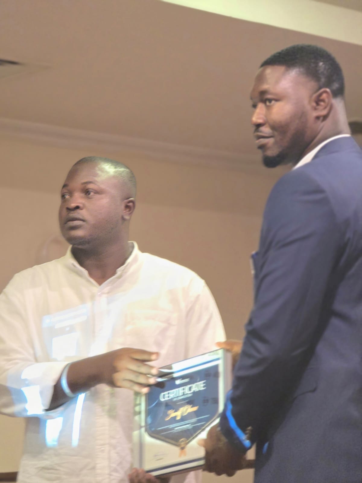 Mr. Sherif  is receiving his Mindsspark Certificate.